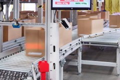 Boxes travel through checkweigh to ensure pick accuracy for Asda at its Clipper Logistics facility in Boughton