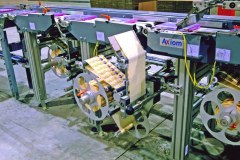 Labelling system for DVDs and other media items on a conveyor system