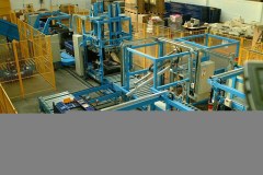 Mechanical handling line at Ford transporting folded containers to stacking area