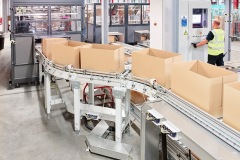 Conveyors transport empty boxes to order pickers at Asda's Boughton Facility